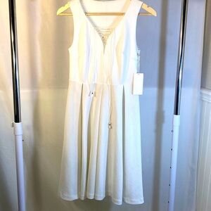 Natalie T - Brand New- White dress. Size X small.